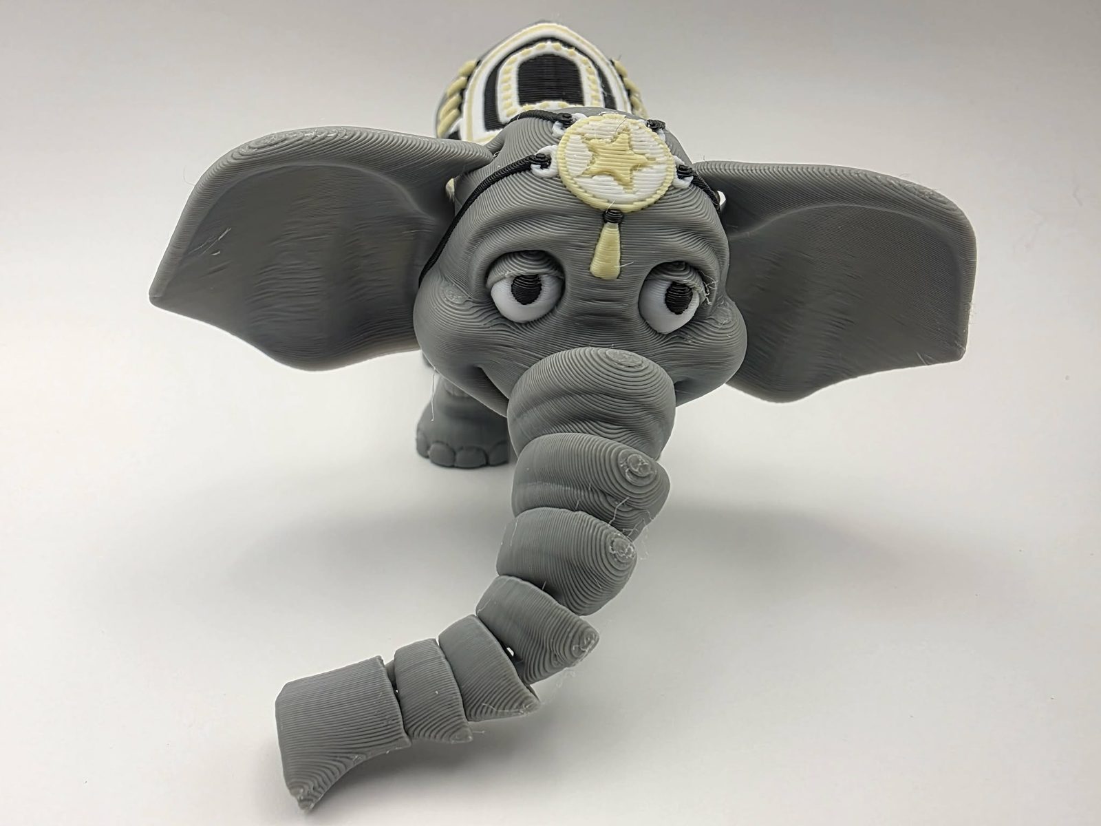 Festival Elephant - Grand March - 5" Long x 4" Tip of Ear to Tip of Ear x 2.75" Tall - Gray, White, Black, Lemon Yellow 3D printed item image