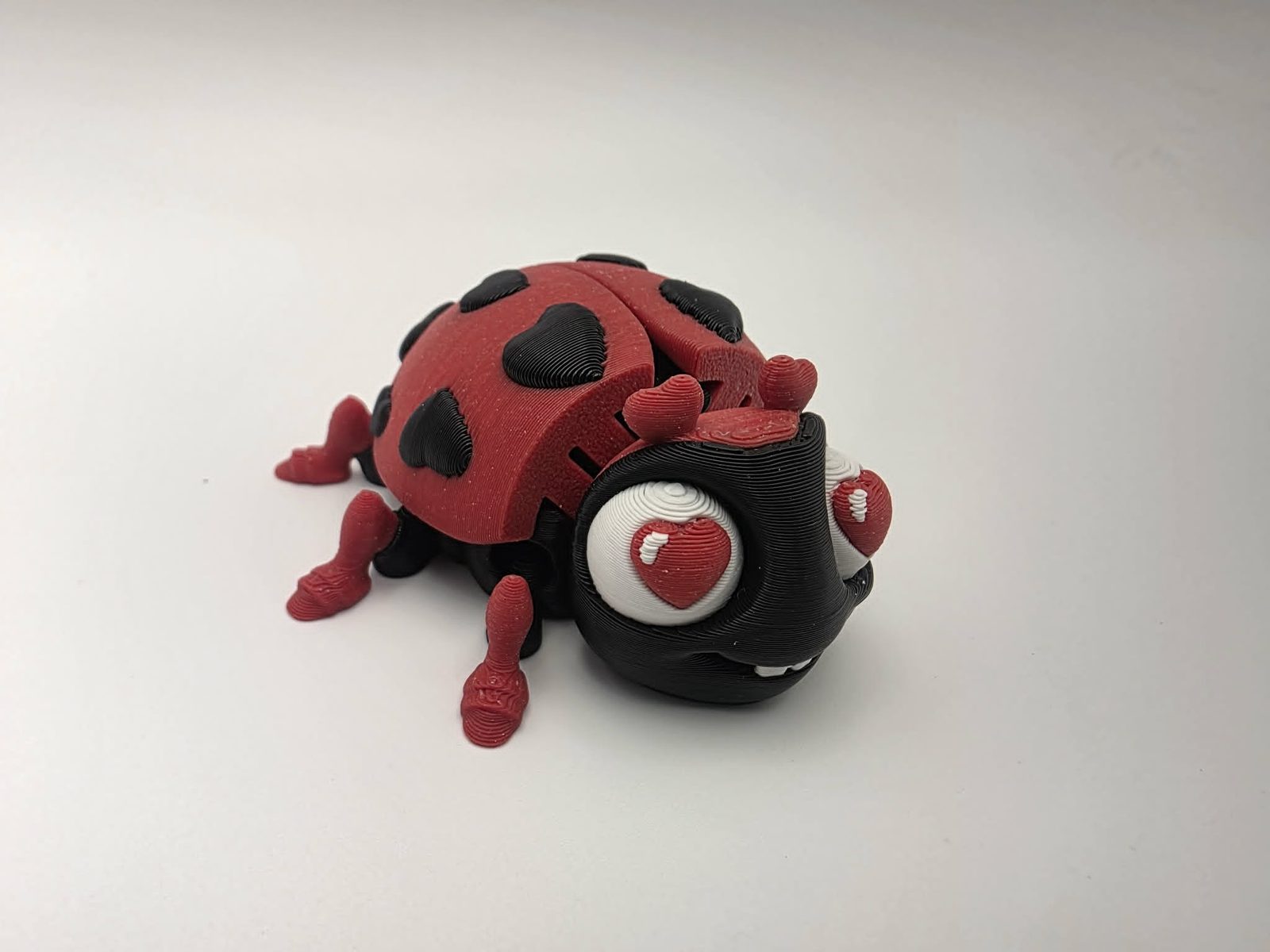 Lovebug - Heart Spot - 2.5" Long x 2.75" Wide x 1.25" Tall - Black, Fire Engine Red, White 3D printed item image