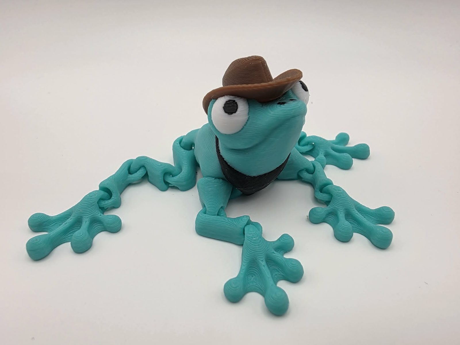 Cowboy Frog - Cowboy Croaker - 2.5" Long x 3.5" Wide from Tip of Toe to Tip of Toe x 1.5" Tall - Mint Green, Chocolate, Black, White 3D printed item image