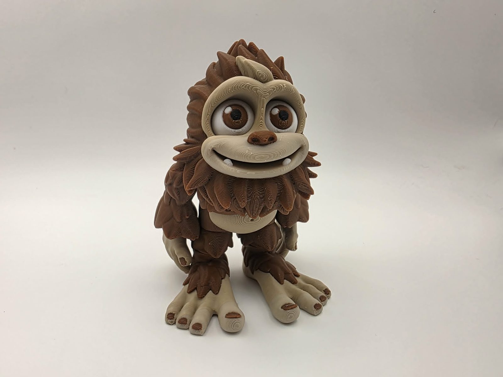 Bigfoot - Stomper - 3" Outer Arm to Outer Arm x 1.75" Tip of Toe to Heel x 4" Tall - Chocolate, Matte Light Brown, White, Black 3D printed item image