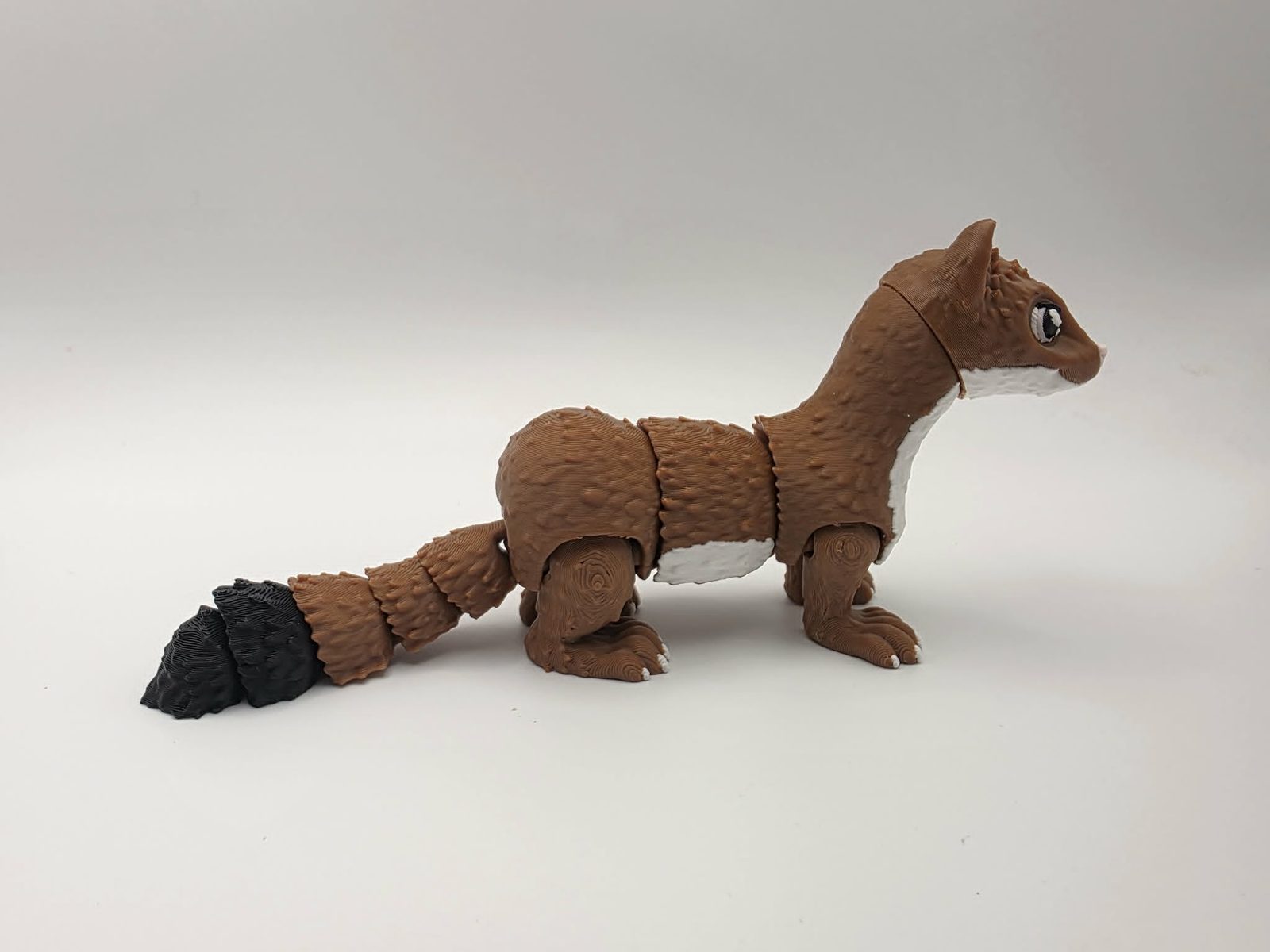 Weasel - Rusty Rascal - 6" Long x 1" Wide x 2.75" Tall - Chocolate, White, Black, Sakura Pink 3D printed item image