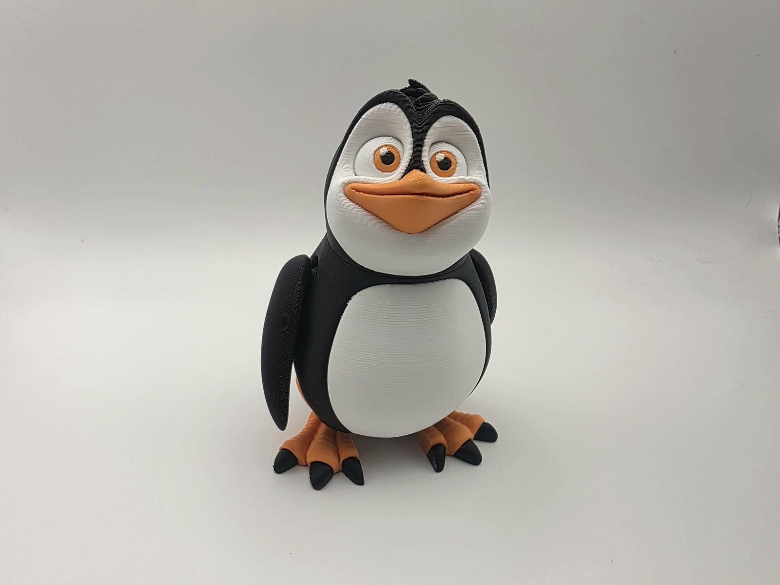 Penguin - Wally Waddles - 3" Wide x 2.5" Chest to Tail x 4.25" - 5" Tall - Black, White, Sunny Orange 3D printed item image