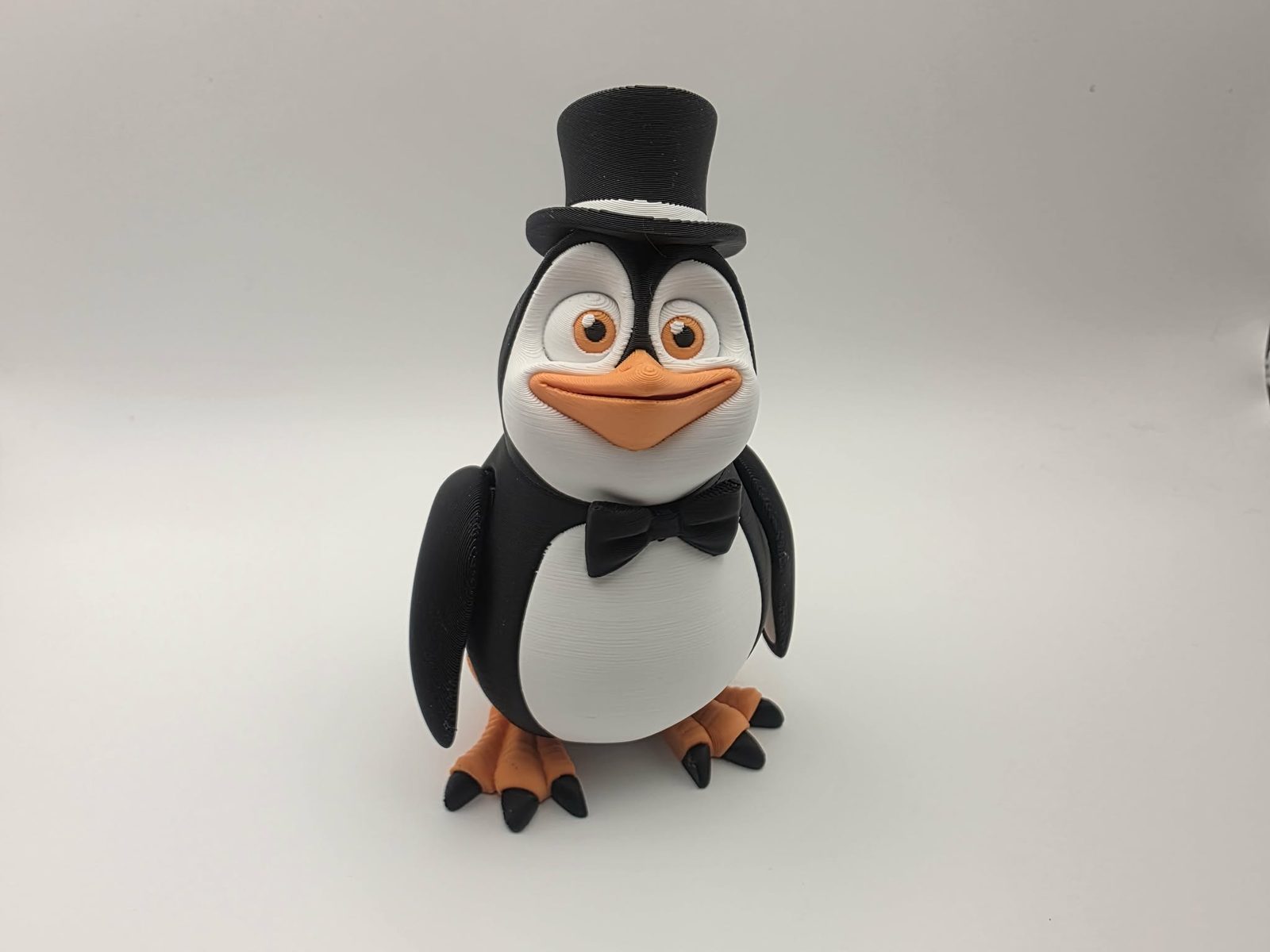 Penguin - Fancy Flipper - 3" Wide x 2.5" Chest to Tail x 4.25" - 5" Tall - Black, White, Sunny Orange 3D printed item image