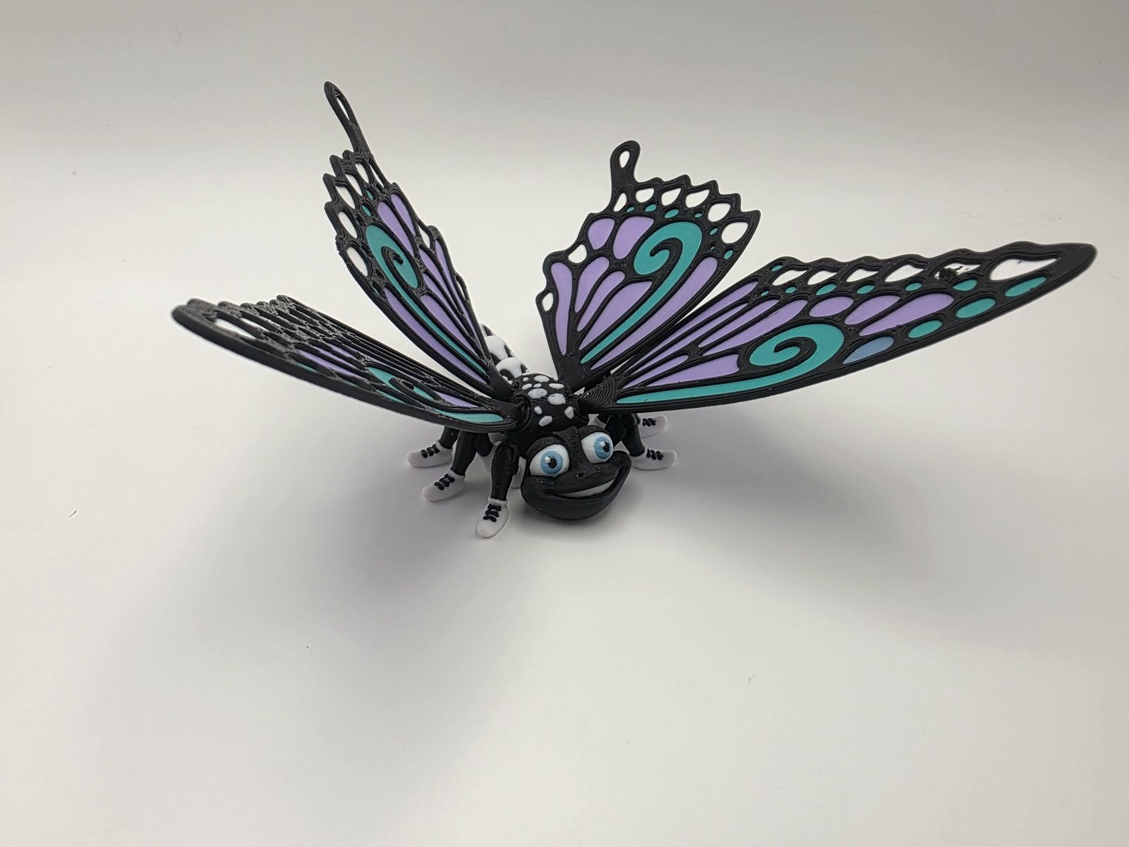 Butterfly - Mint Meadow Butterfly - 5" Long Tip of Wing to Tip of Wing x 5" Wide Tip of Wing to Tip of Wing x 2.25" Tall - Black, White, Sky Blue, Mint Green 3D printed item image