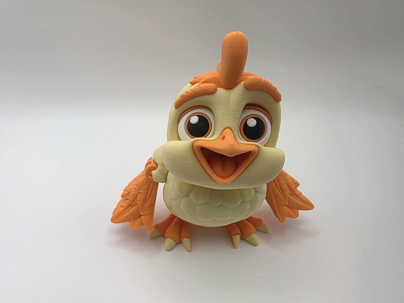 Chick - Sunny - 3" Chest to Tail x 4.5" Wing to Wing x 4.5" Tall - Lemon Yellow, Sunny Orange, White, Black 3D printed item image