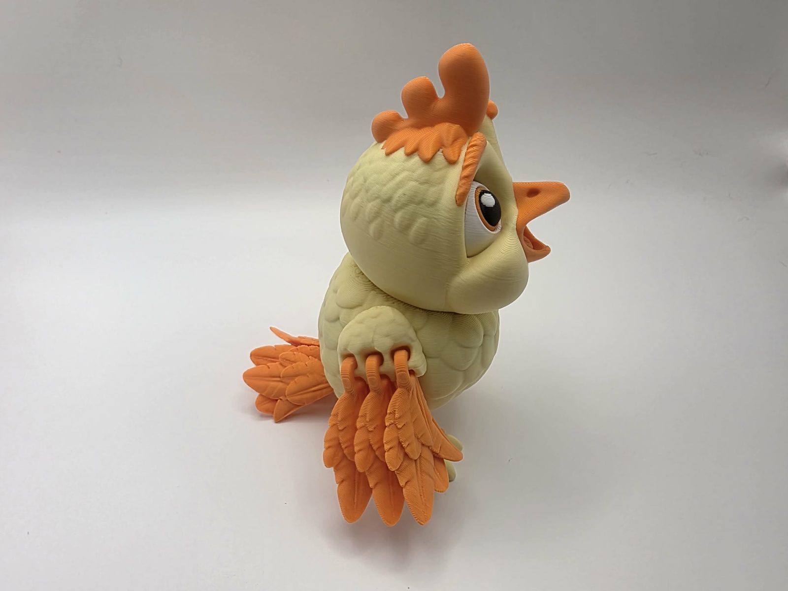 Chick - Sunny - 3" Chest to Tail x 4.5" Wing to Wing x 4.5" Tall - Lemon Yellow, Sunny Orange, White, Black 3D printed item image