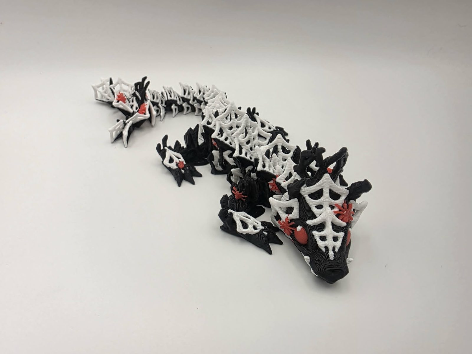 Spider Dragon - Widow Web Dragon - 7.75" Long x 2.5" Wide Elbow to Elbow x 1.5" Tall - Black, White, Cherry Red 3D printed item image