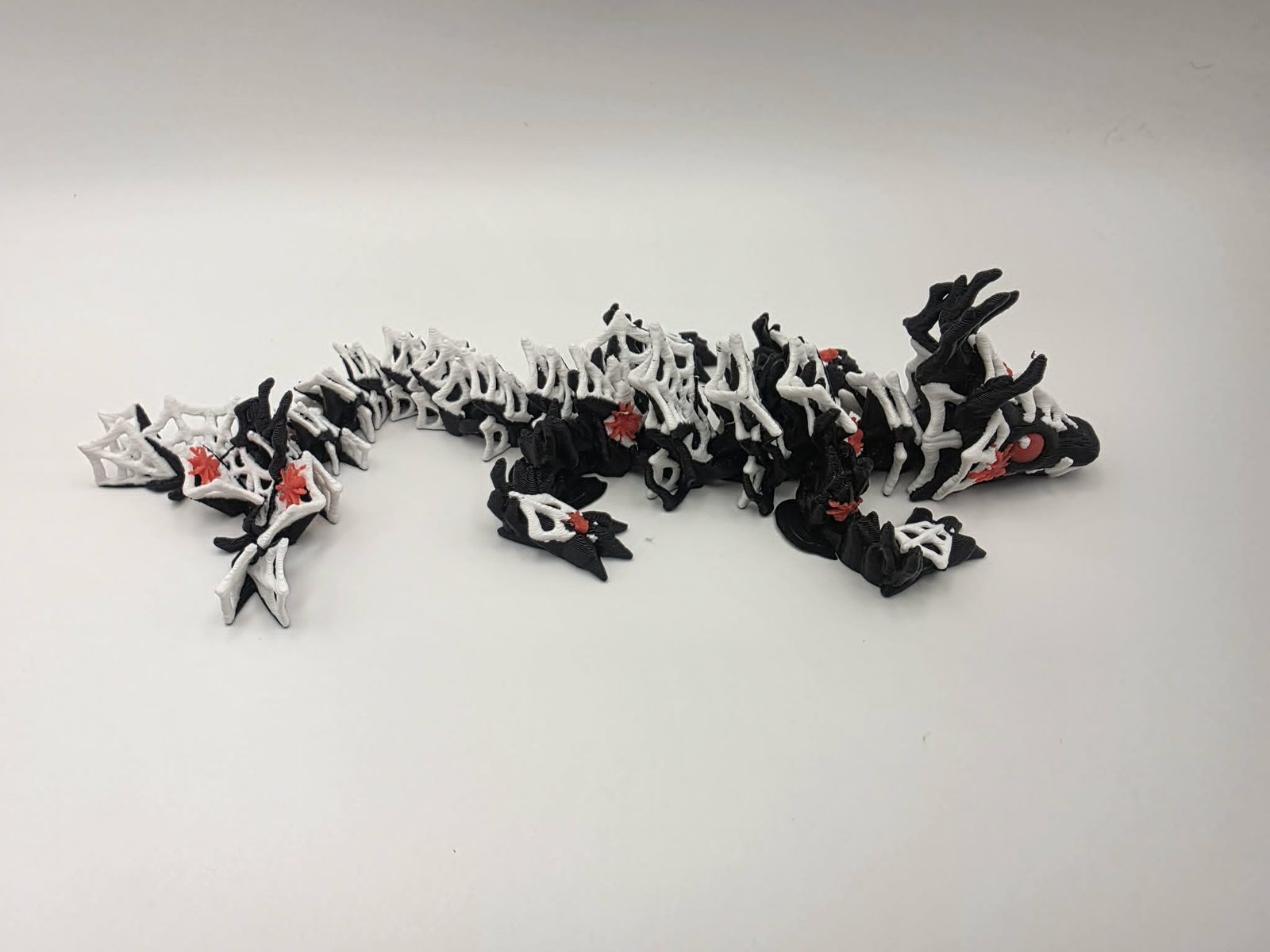 Spider Dragon - Widow Web Dragon - 7.75" Long x 2.5" Wide Elbow to Elbow x 1.5" Tall - Black, White, Cherry Red 3D printed item image