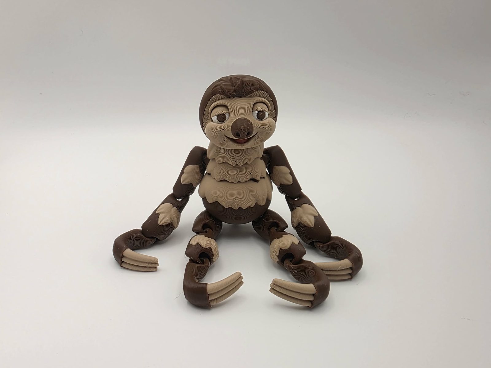 Sloth - Brown Sugar Sloth - 3" Wide Outer Arm to Outer Arm x 1" Chest to Back x 5" Tall - Chocolate, Matte Light Brown, White, Pink 3D printed item image