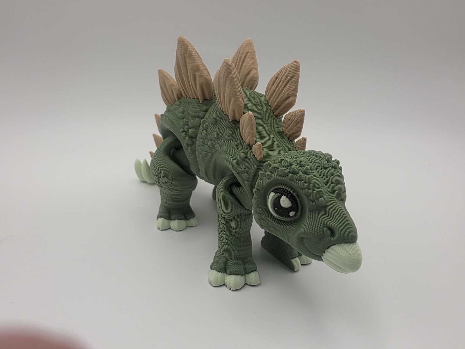 Stegosaurus - Stego Sprout - 5.5" Long x 2" Wide x 2.75" Tall - Matte Olive Green, Matte Light Brown, Matte Mint Green, Black 3D printed item image