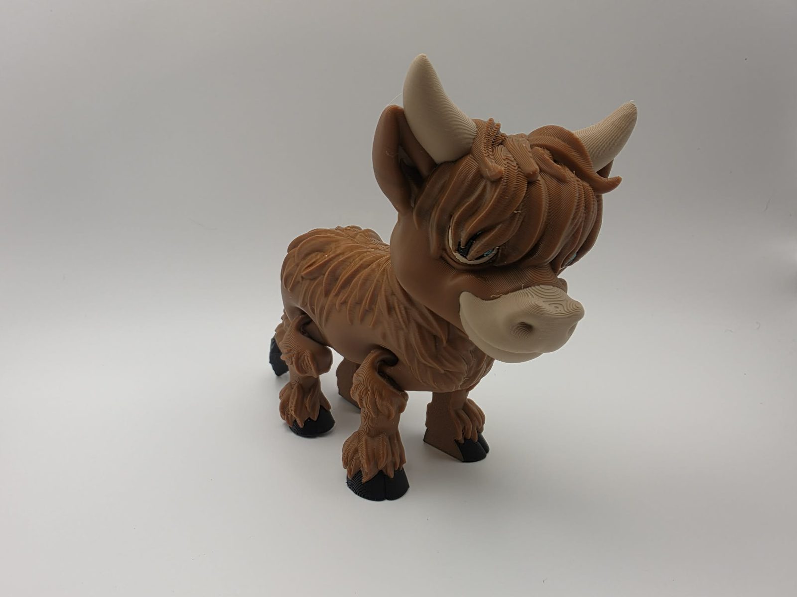 Highland Cow - Butterscotch Moo - 5.25" Long x 1.75" Wide x 4" Tall - Chocolate, Black, Matte Light Brown, Light Blue 3D printed item image